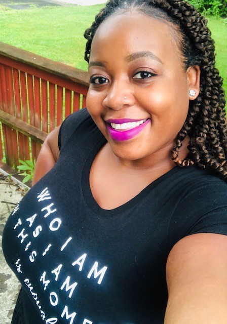 Ebony White, PhD, wearing a t-shirt with her quote “Who I am, as I am, in this moment, is enough.” 